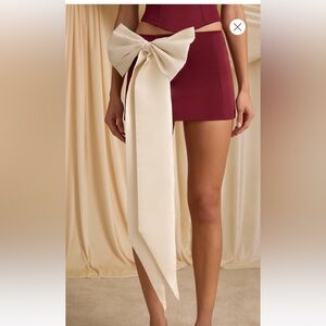 Bow-Detail Low-Rise Mini Skirt in Wine Red